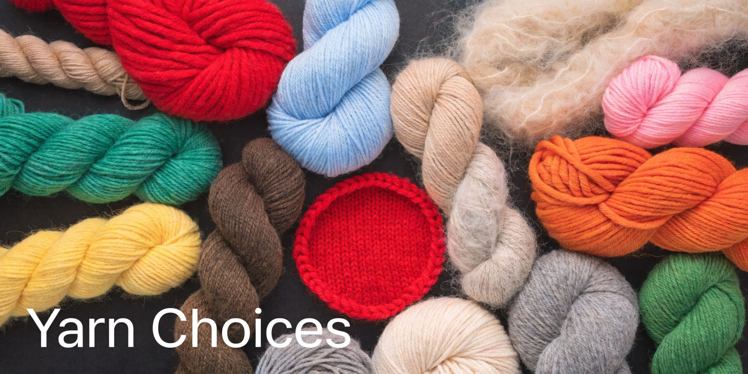 A colorful arrangement of various yarn skeins and a knitted red circular piece on a dark background.