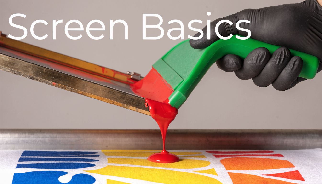 A close-up view of a screen printing process where red ink is being applied to fabric.