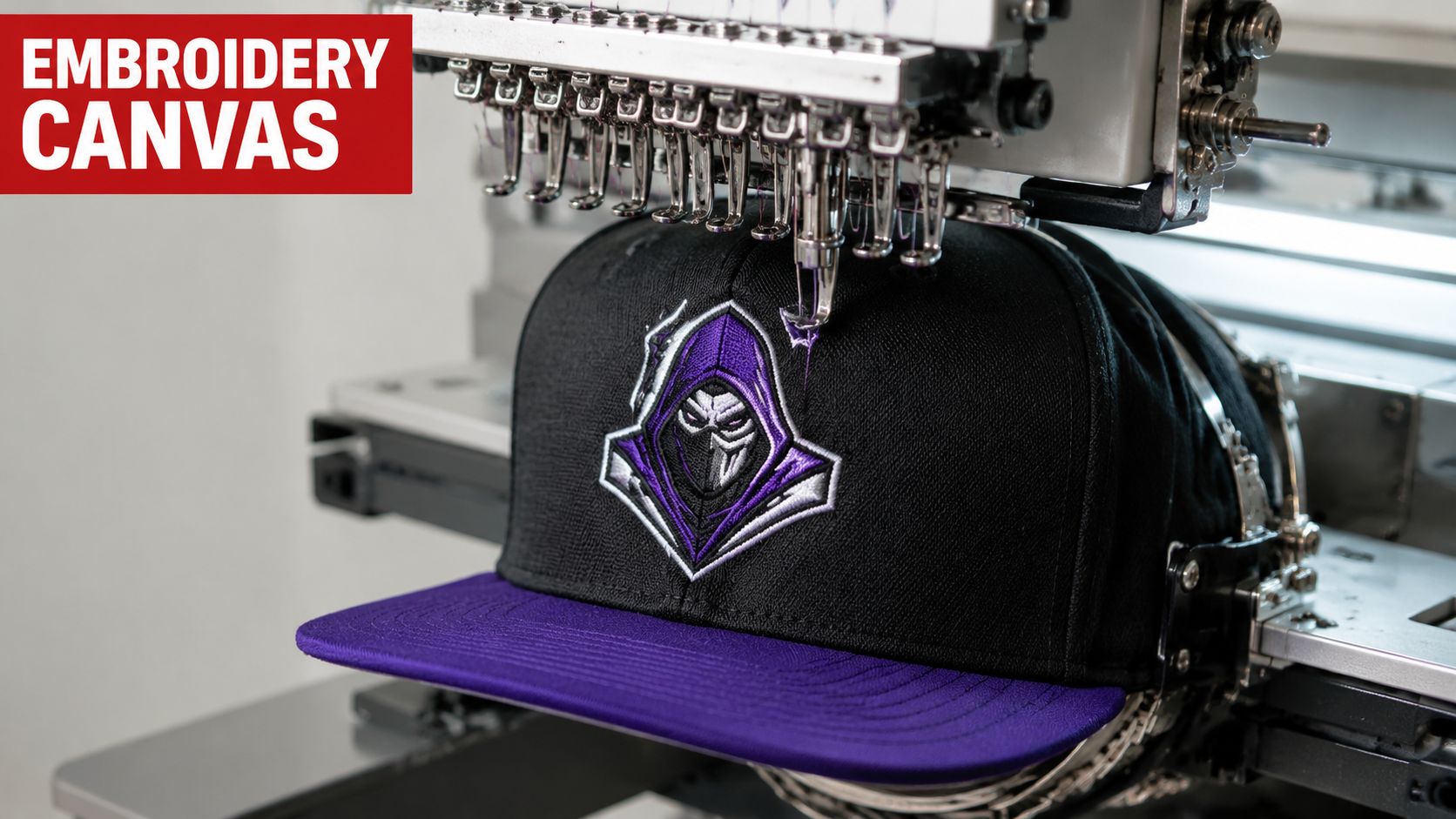A professional embroidery machine stitching a purple and black hooded character logo onto a high profile hat.