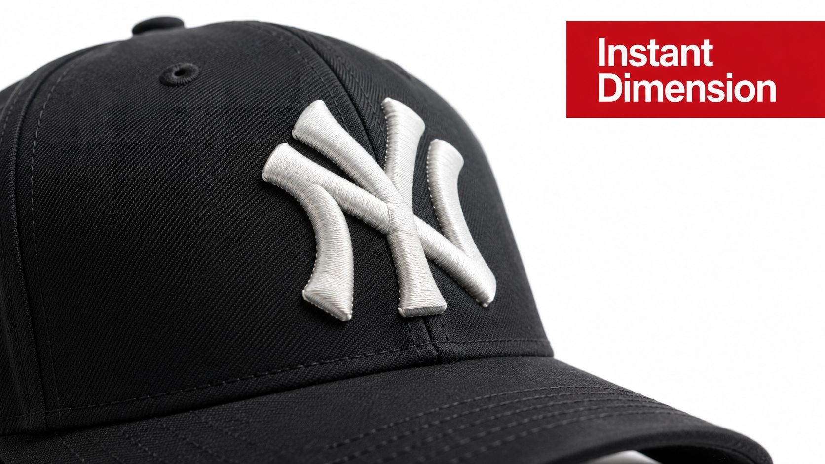 Close up view of high quality white 3D puff embroidery on a black New York Yankees baseball cap.